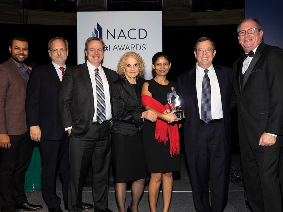 TIAA board of trustees colleagues stand with Gleason at the 2022 NACD DE&I Awards Gala.